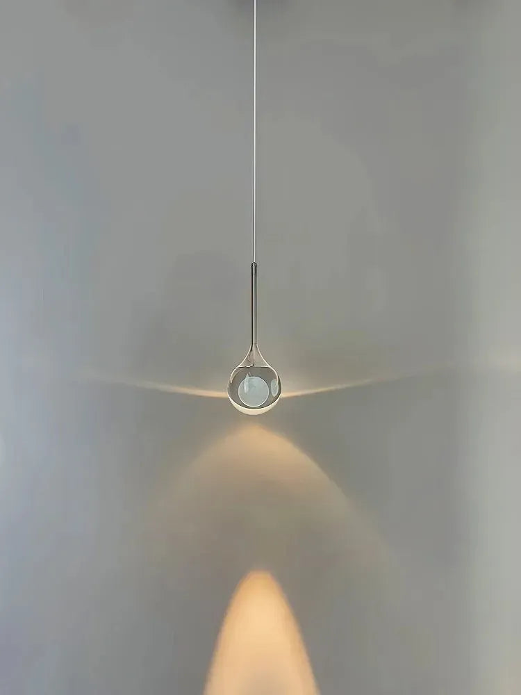 Suspension boule de verre design lunaire