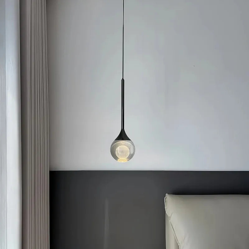 Suspension boule de verre design lunaire
