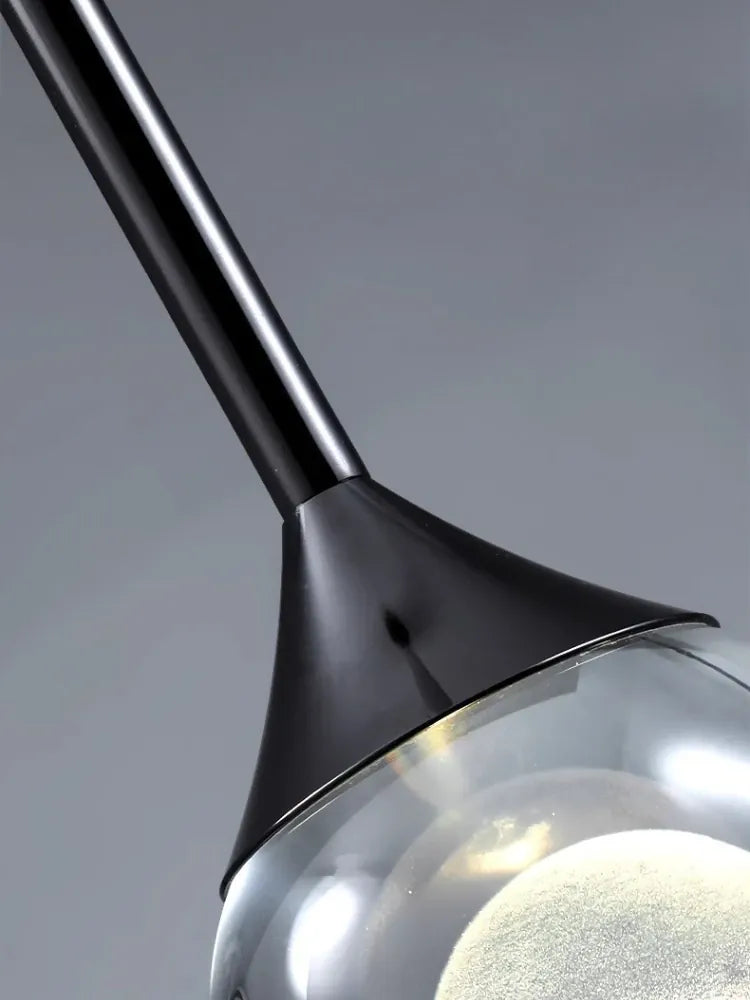 Suspension boule de verre design lunaire